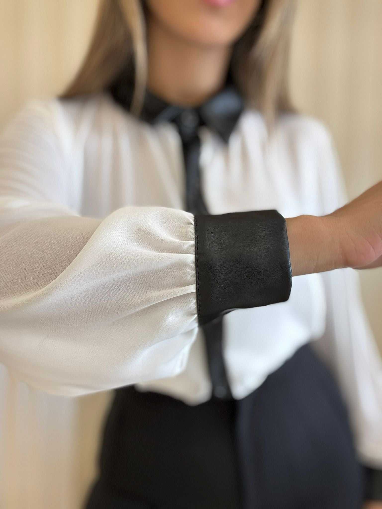 White long sleeve blouse with black contrast collar and button placket