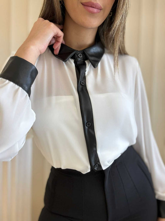 White long sleeve blouse with black contrast collar and button placket