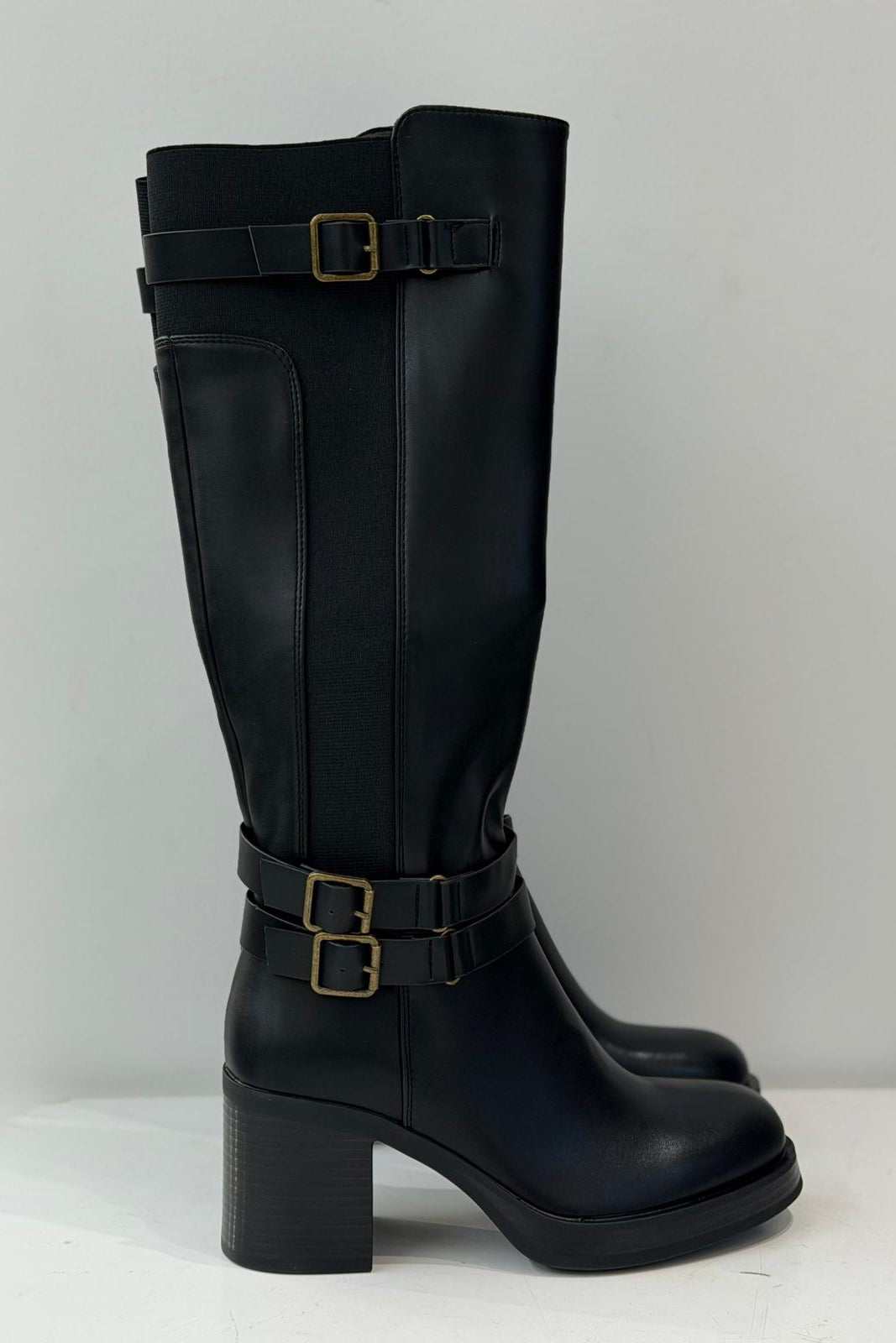 Black knee-high boots with block heels and buckle straps for women